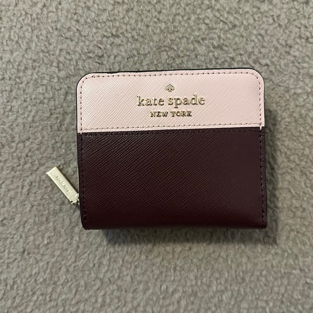 Brand New never used small wallet from Kate Spade. Zipper encloser.